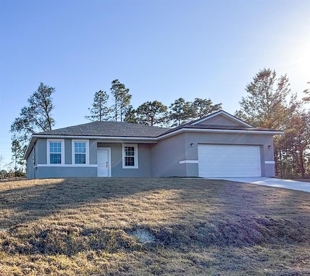 ranch-style home featuring a front yard and a garage