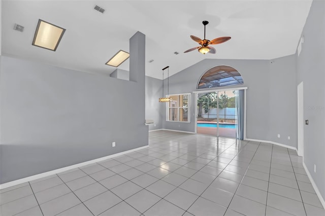 tiled spare room with high vaulted ceiling and ceiling fan