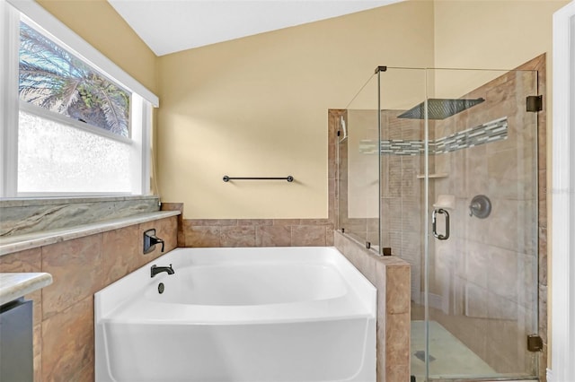 bathroom featuring independent shower and bath and tile walls