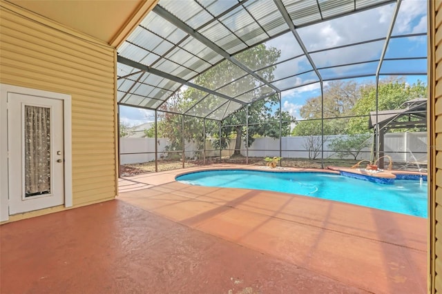 view of pool featuring a lanai, a patio, and pool water feature