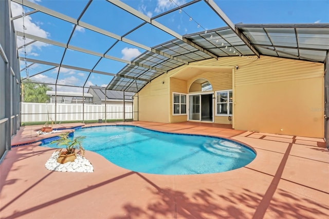 view of pool with a lanai and a patio area