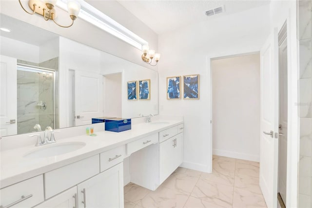 bathroom with vanity, a textured ceiling, and walk in shower