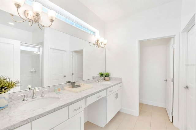 bathroom featuring an inviting chandelier, vanity, an enclosed shower, and tile patterned flooring