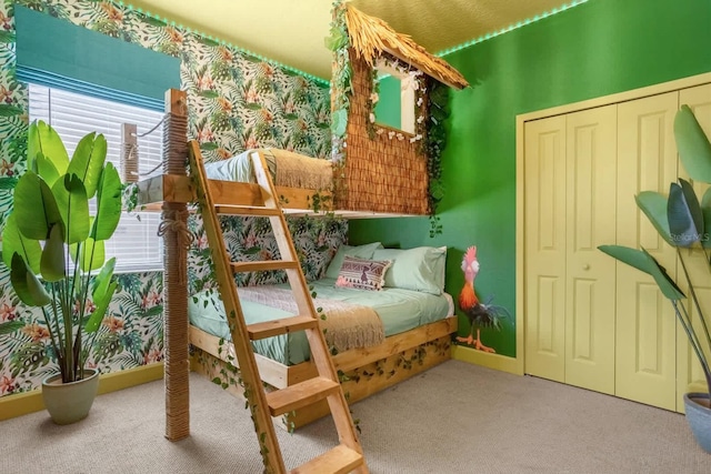 bedroom featuring carpet floors and a closet