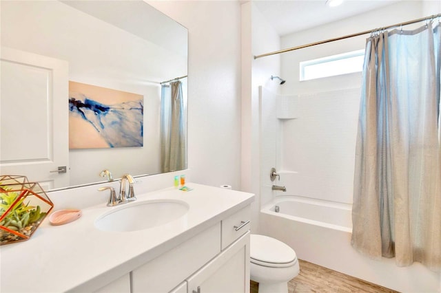 full bathroom featuring shower / bath combo, wood-type flooring, vanity, and toilet