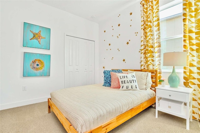 bedroom with carpet and a closet