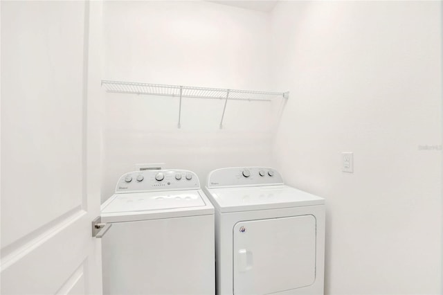 washroom featuring separate washer and dryer