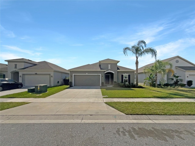 view of front of house with a garage and a front lawn