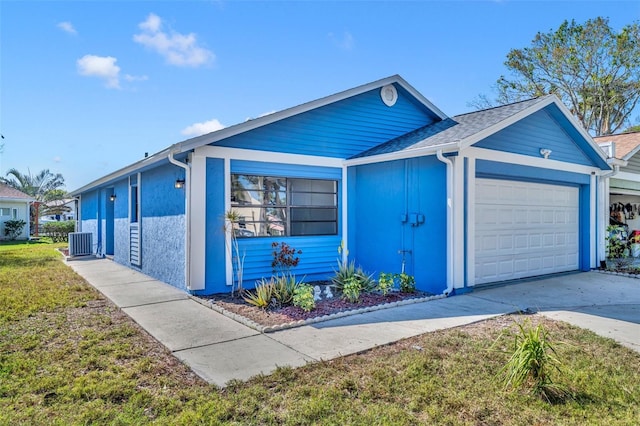 single story home with a garage and central AC