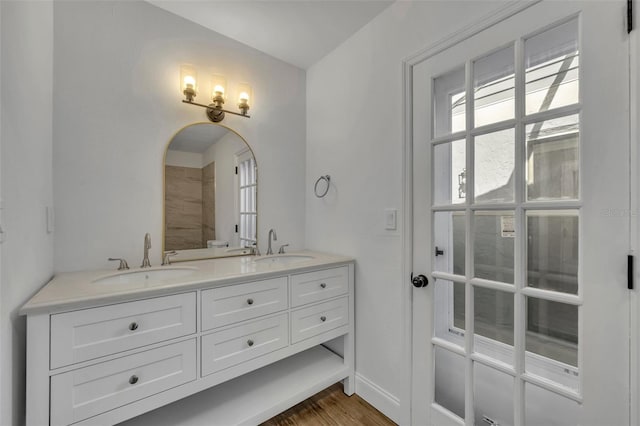 bathroom featuring vanity and hardwood / wood-style floors