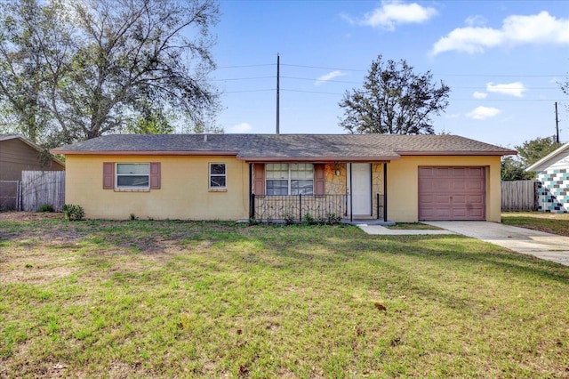 ranch-style house featuring a garage and a front yard