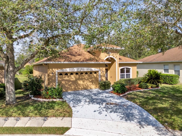 view of front of house featuring a garage and a front yard