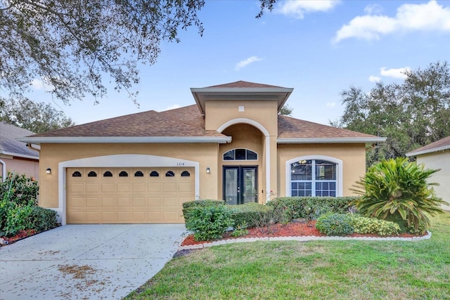 view of front facade featuring a garage and a front yard