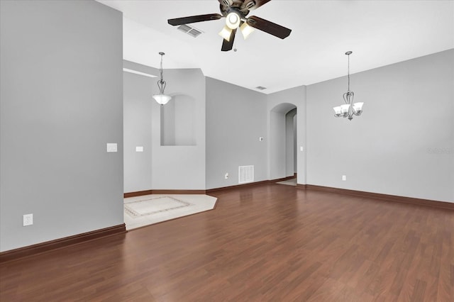 unfurnished living room featuring ceiling fan and dark hardwood / wood-style flooring