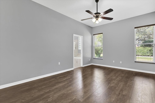 spare room featuring dark hardwood / wood-style floors and ceiling fan