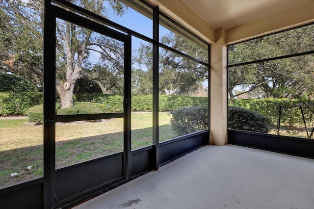 unfurnished sunroom featuring plenty of natural light