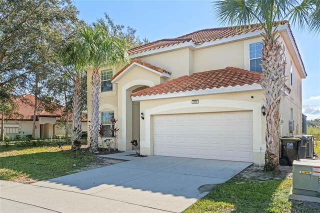 mediterranean / spanish house with central AC and a garage