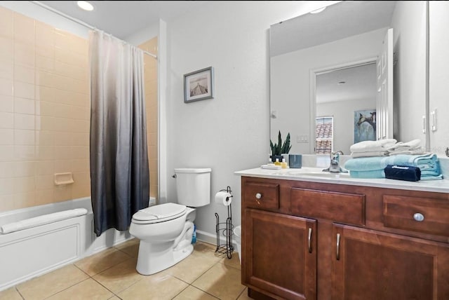 full bathroom featuring tile patterned floors, shower / bath combo with shower curtain, vanity, and toilet