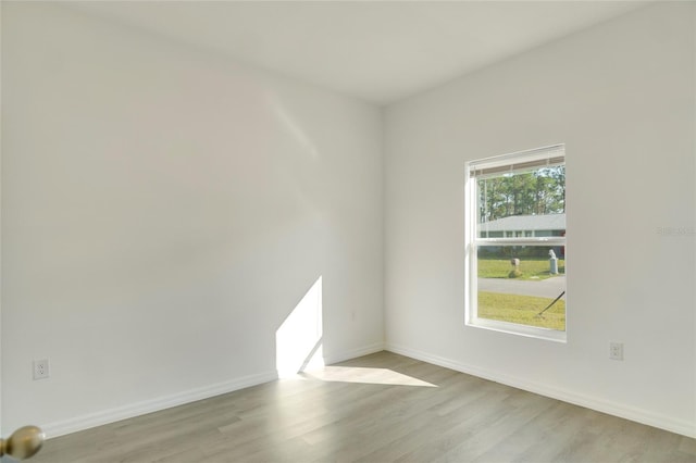 spare room featuring light hardwood / wood-style flooring