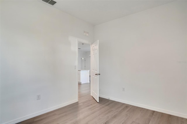 unfurnished room with light hardwood / wood-style floors