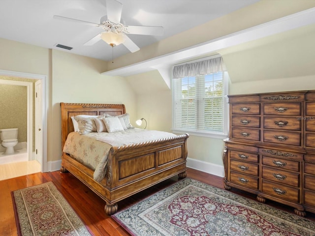 bedroom featuring dark wood-style floors, ceiling fan, visible vents, and baseboards