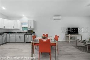 dining area featuring an AC wall unit