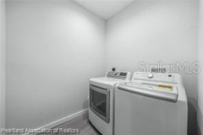 washroom featuring independent washer and dryer