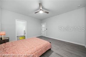 bedroom featuring ceiling fan and dark hardwood / wood-style flooring