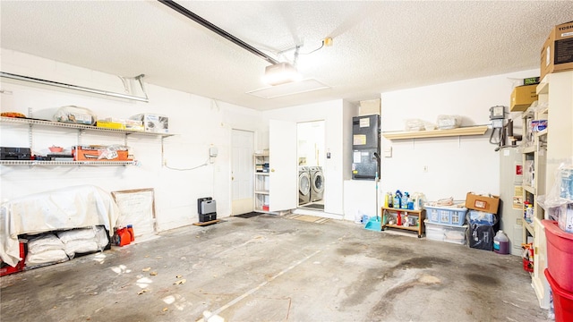 garage with heating unit, a garage door opener, and washer and dryer