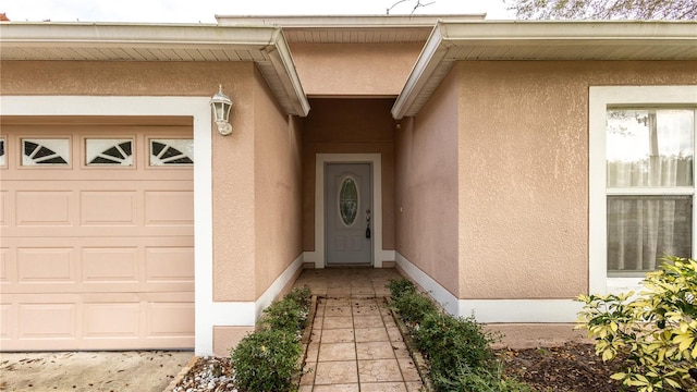 doorway to property featuring a garage