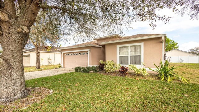 view of front of home featuring a garage and a front lawn