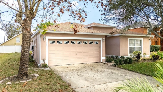 view of front of house featuring a garage and a front yard