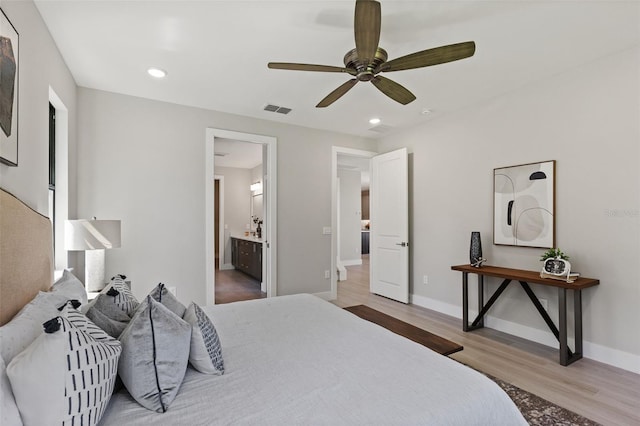 bedroom featuring wood-type flooring, ceiling fan, and ensuite bathroom