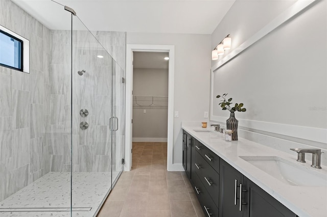 bathroom with vanity, tile patterned flooring, and a shower with shower door