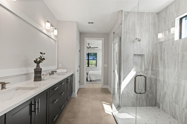 bathroom featuring an enclosed shower, vanity, and tile patterned floors