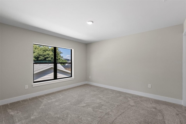 unfurnished room with light colored carpet