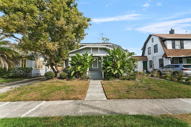 view of front of home with a front lawn