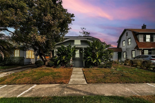 view of front of house with a lawn