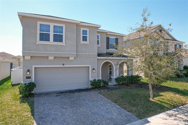 view of front of home with a garage and a front yard