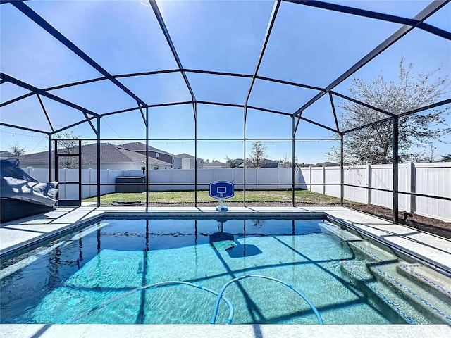 view of swimming pool featuring a lanai