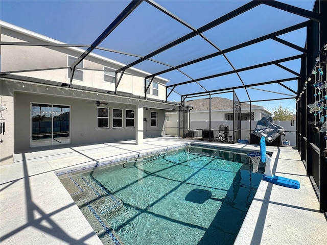 view of pool featuring a lanai and a patio