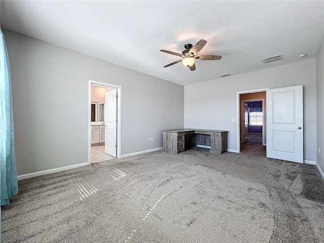 unfurnished living room with light carpet, a textured ceiling, and ceiling fan