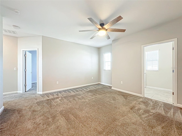 carpeted empty room with ceiling fan