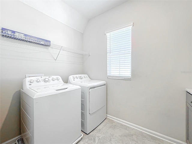 laundry area with separate washer and dryer