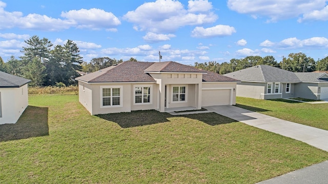 view of front of home with a garage and a front lawn