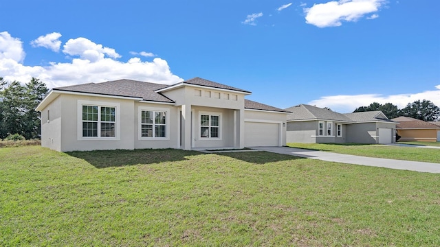 view of front facade featuring a garage and a front lawn