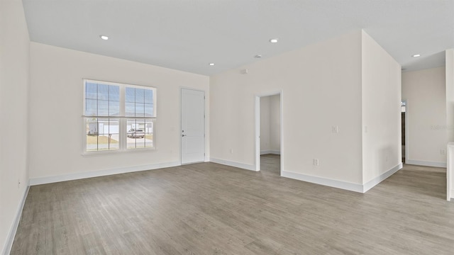 spare room with light hardwood / wood-style floors