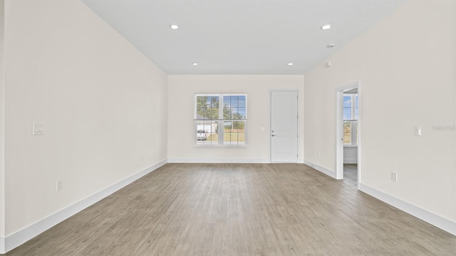 unfurnished room with light hardwood / wood-style flooring and a healthy amount of sunlight