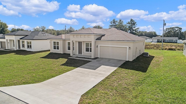 view of front of home with a garage and a front lawn