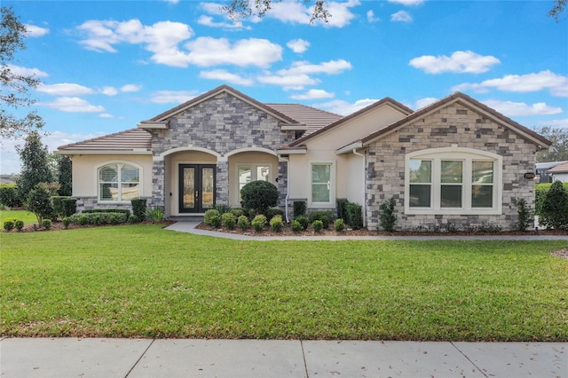 view of front facade featuring french doors and a front yard